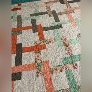 Handmade patchwork quilt. Peach, green, gray. Measures 61”x 46.5” New